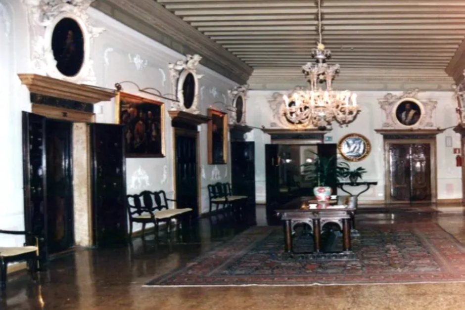 A large room with many chairs and tables.