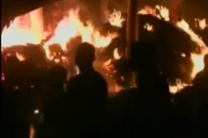 A fire is burning in the background of this picture.